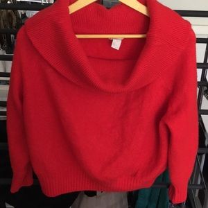 Red off the shoulder sweater.